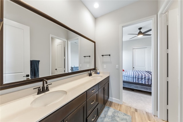7631 Capstone Ct, Riverside, CA 92506 - ensuite bathroom with double vanity, wood finished floors, baseboards, and ceiling fan