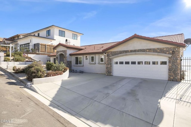 mediterranean / spanish-style home with a garage