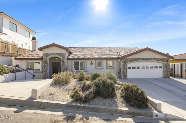 mediterranean / spanish house featuring a garage