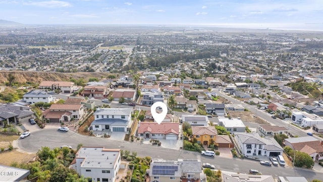 birds eye view of property with a residential view