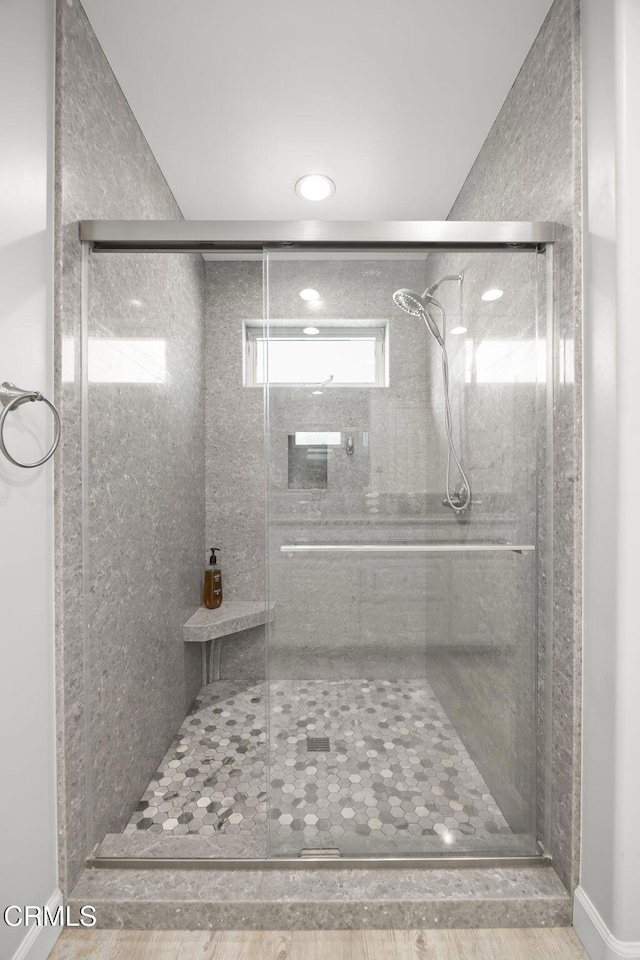 bathroom with a shower stall