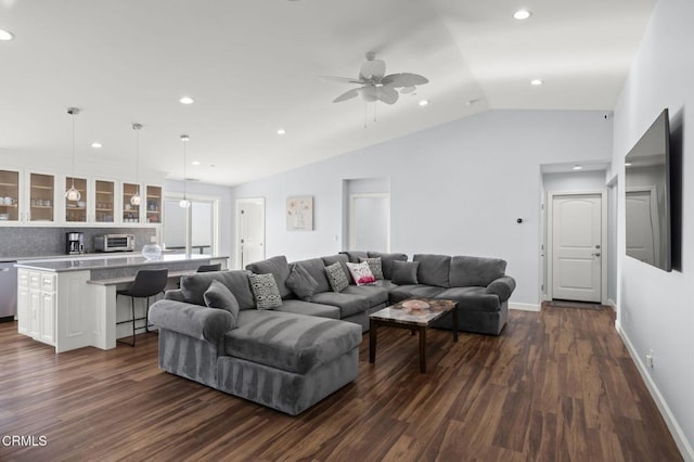 living room with baseboards, lofted ceiling, dark wood-style floors, and a toaster