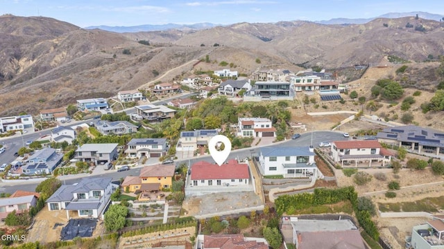 bird's eye view with a residential view and a mountain view