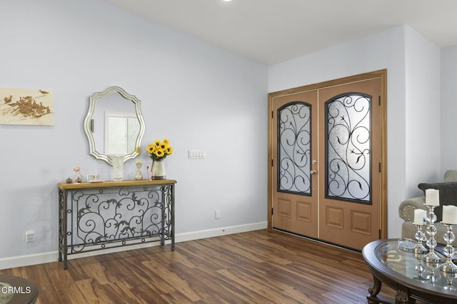 foyer entrance featuring baseboards, french doors, and dark wood-type flooring