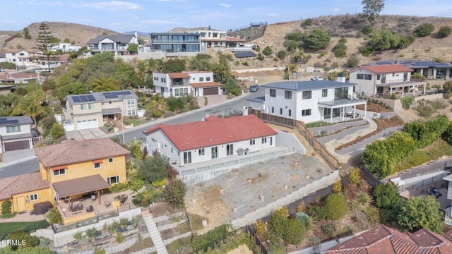 drone / aerial view featuring a residential view and a mountain view