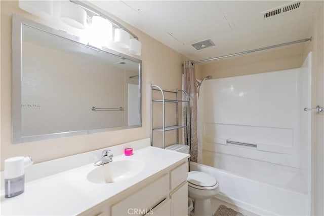 full bathroom featuring shower / tub combo, vanity, and toilet
