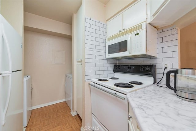 kitchen featuring decorative backsplash, light parquet floors, white appliances, and white cabinetry