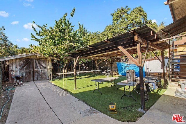 exterior space featuring a yard and an outbuilding