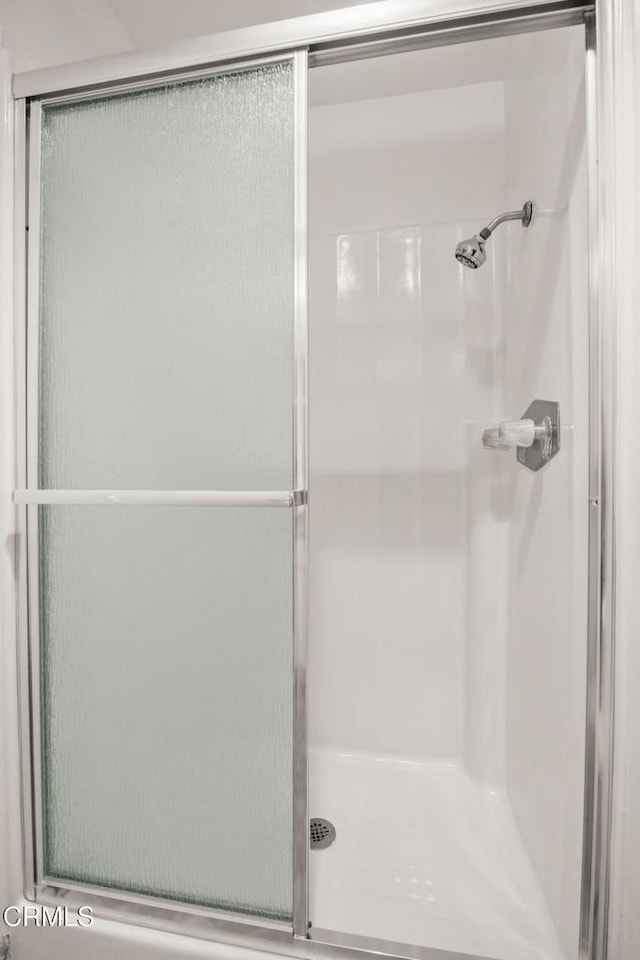 bathroom featuring a shower stall