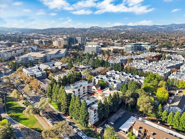 birds eye view of property with a mountain view