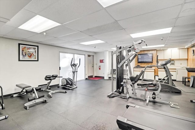 exercise room featuring a paneled ceiling