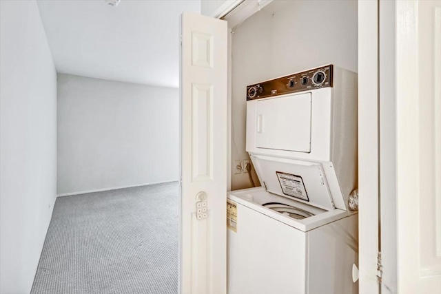 laundry room with carpet floors and stacked washer and clothes dryer