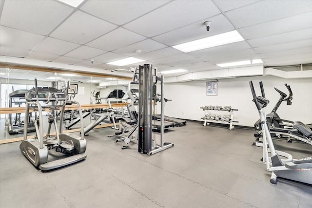 workout area with a paneled ceiling