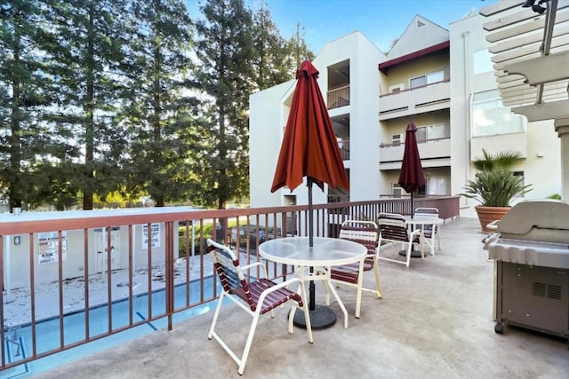 view of patio with a grill