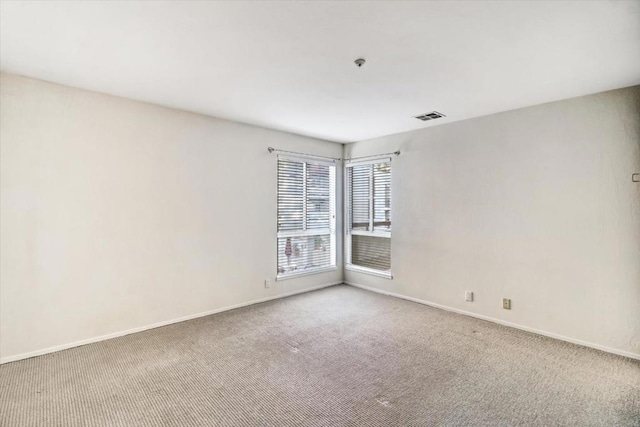 view of carpeted spare room