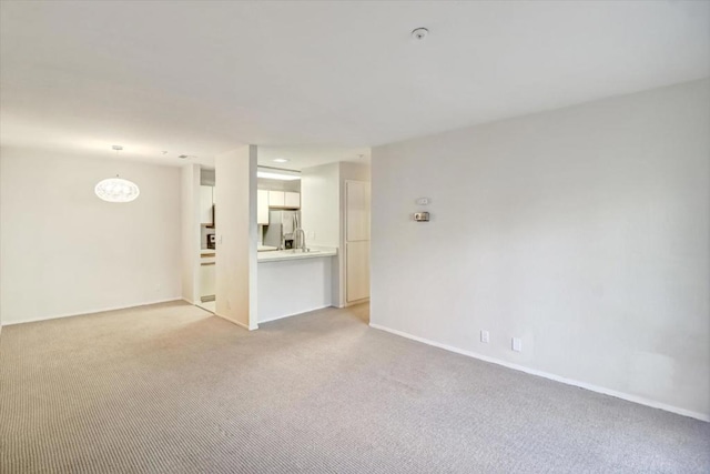 empty room featuring light colored carpet