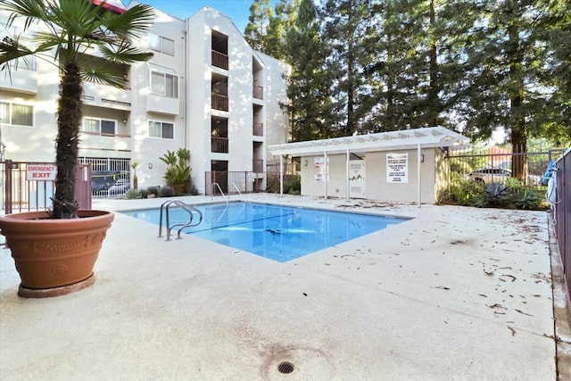 view of swimming pool featuring a patio