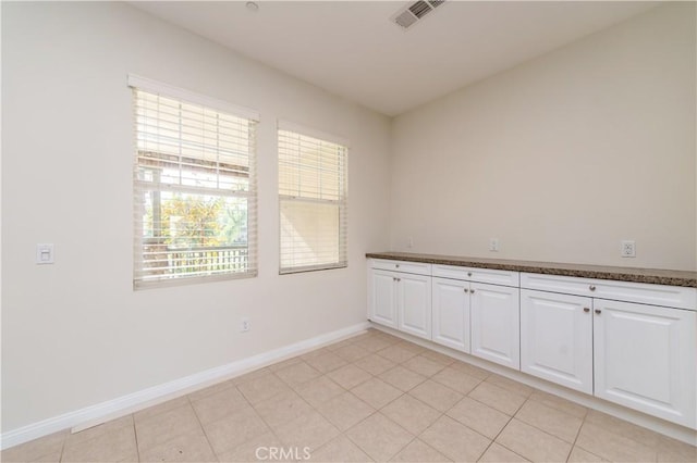 spare room with light tile patterned floors