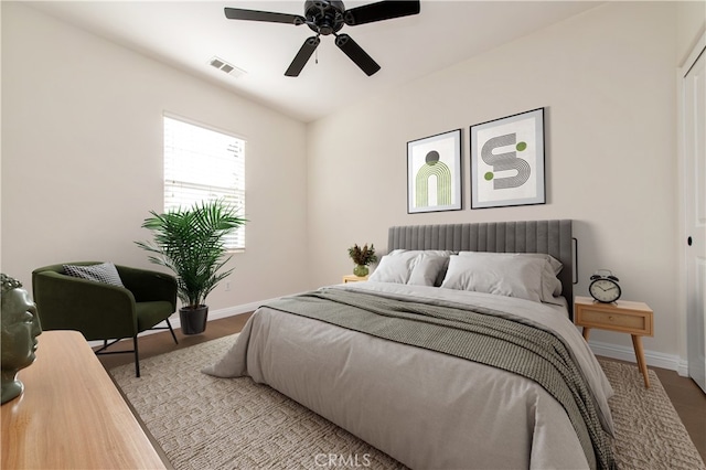 bedroom with ceiling fan and light wood-type flooring