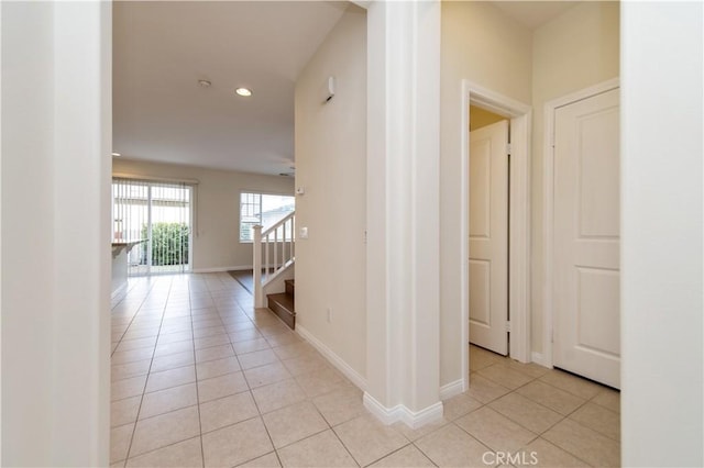 hallway with light tile patterned floors