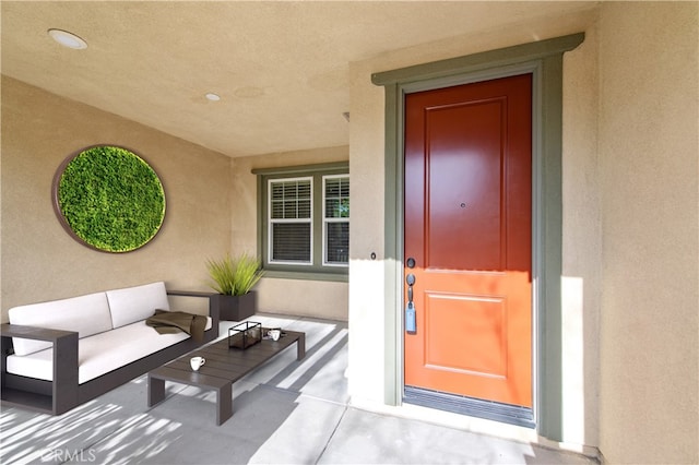 doorway to property with an outdoor hangout area