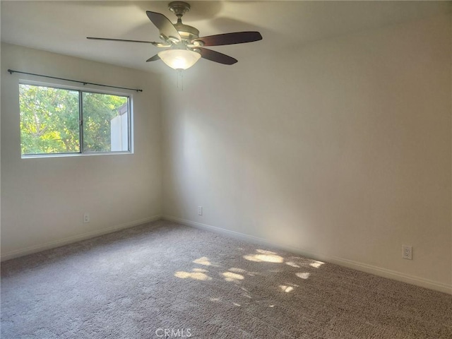 unfurnished room with carpet and ceiling fan