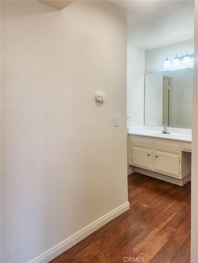 bathroom featuring wood-type flooring and vanity