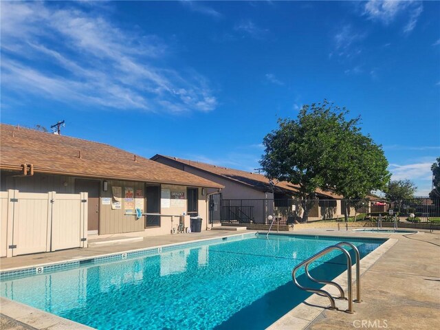 view of swimming pool featuring a patio area