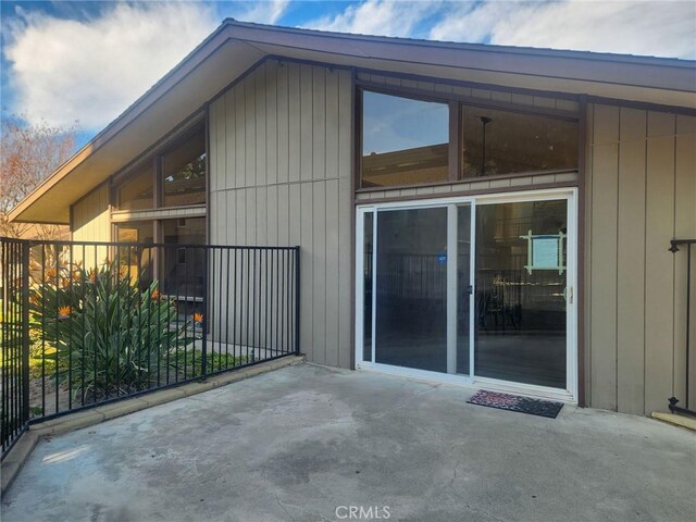 view of side of home with a patio area