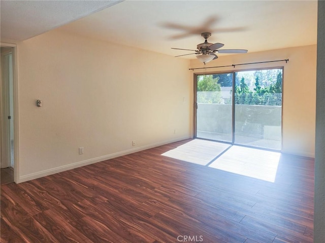 unfurnished room with ceiling fan and dark wood-type flooring