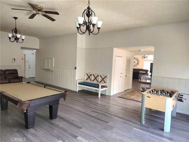 game room with a textured ceiling, hardwood / wood-style flooring, ceiling fan, and billiards