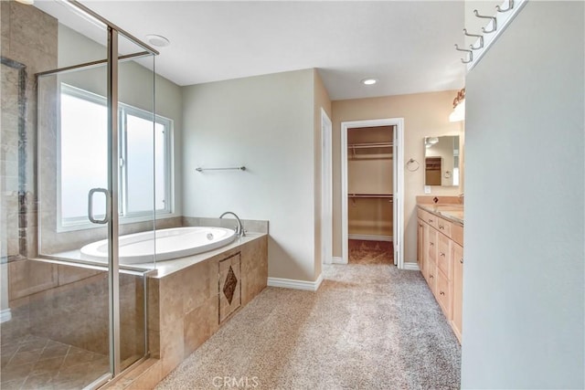 bathroom with separate shower and tub and vanity