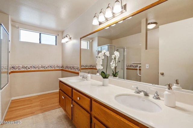 bathroom featuring hardwood / wood-style flooring and vanity