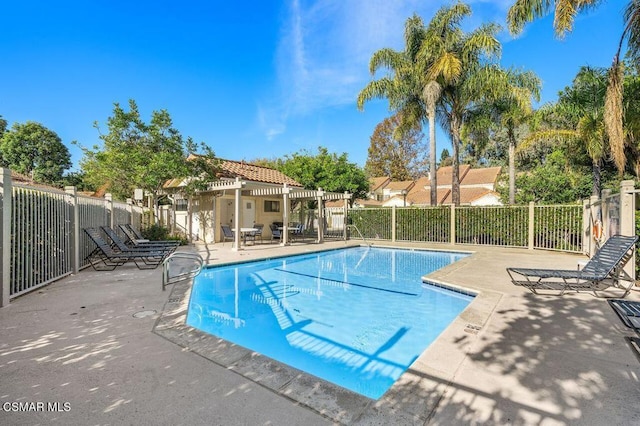 view of swimming pool with a patio area