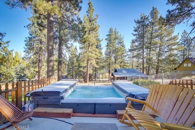 view of pool with a covered hot tub