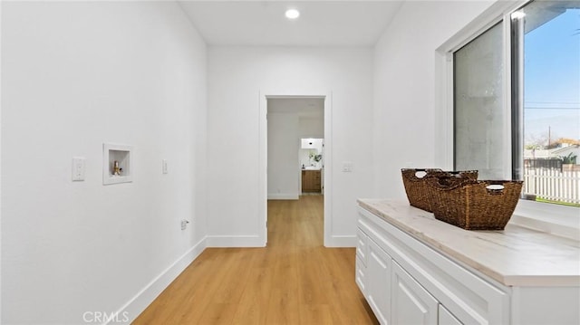 corridor featuring light hardwood / wood-style floors