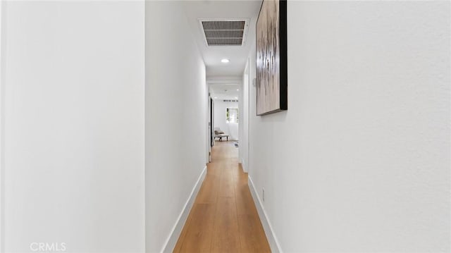 hall with light hardwood / wood-style flooring