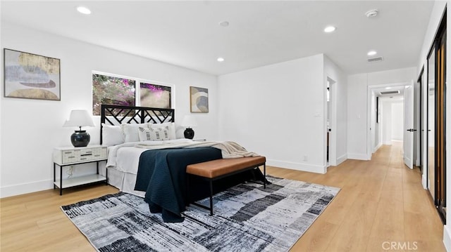 bedroom with light hardwood / wood-style floors