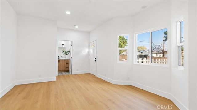 unfurnished room with light hardwood / wood-style floors