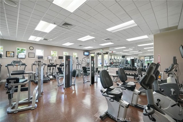 gym featuring a paneled ceiling