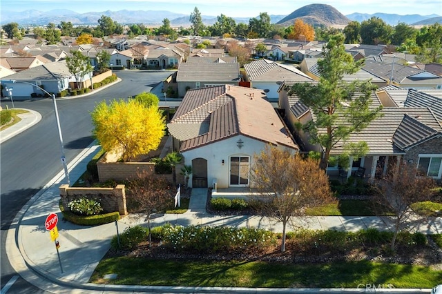 birds eye view of property with a mountain view