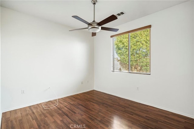 spare room featuring ceiling fan and wood-type flooring