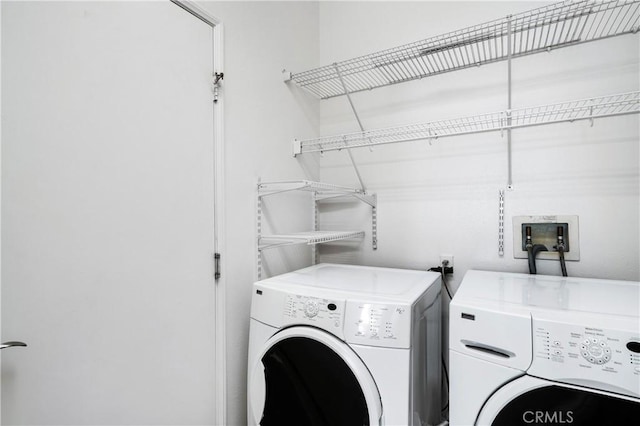 washroom with washer and clothes dryer