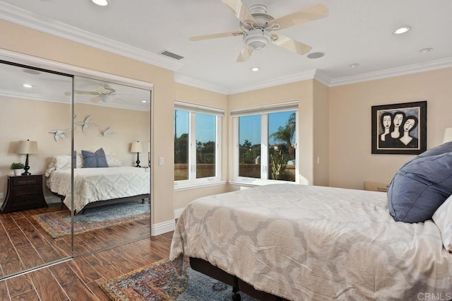 bedroom featuring ceiling fan, a closet, and ornamental molding