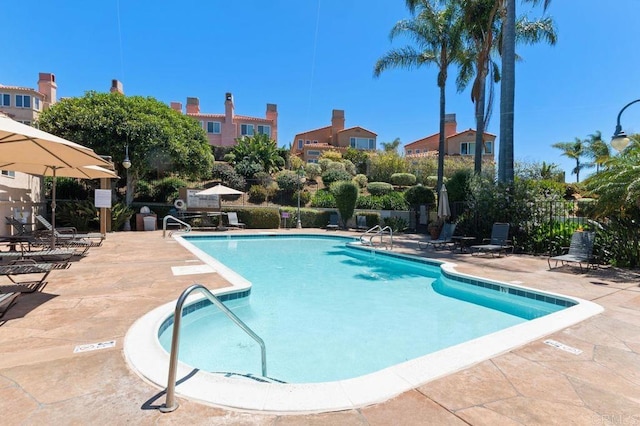 view of swimming pool featuring a patio area