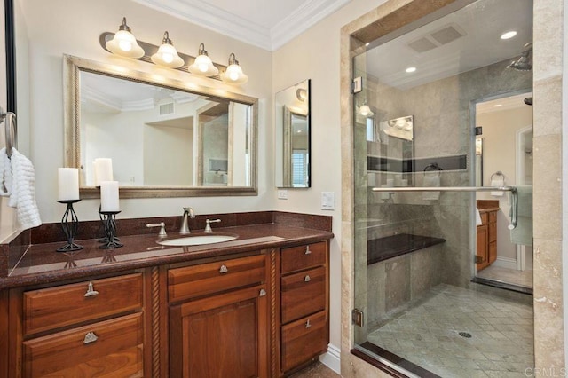 bathroom with a shower with shower door, ornamental molding, and vanity