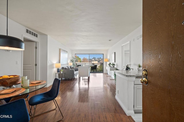 dining room with hardwood / wood-style flooring