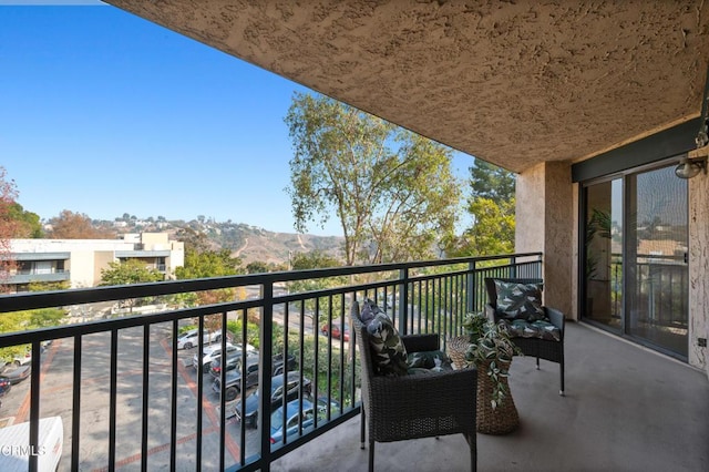 balcony featuring a mountain view