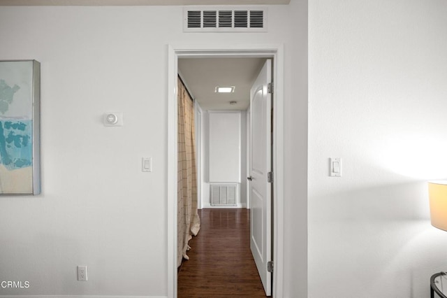 corridor with dark hardwood / wood-style floors