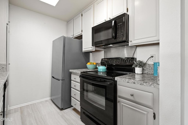 kitchen with white cabinetry, black appliances, and light stone counters